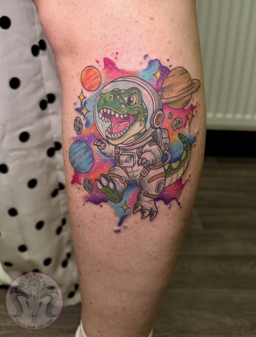 Watercolour astronaut dinosaur with planets on the calf