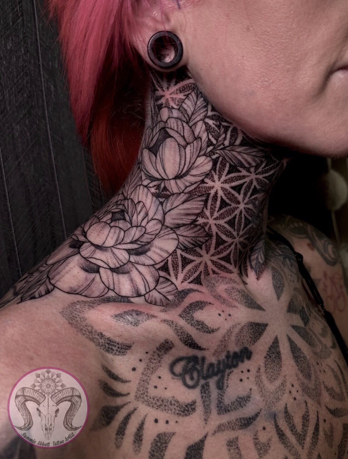 Peony blossoms over flower-of-life geometry on the neck and collarbone