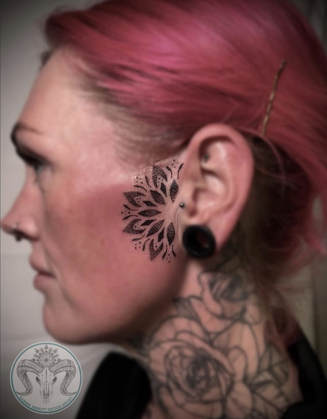 Dotwork mandala tattoo by the ear
